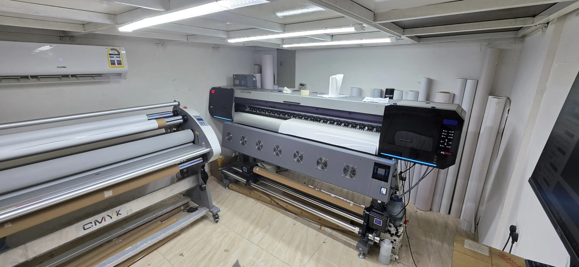 Large-format printing and laminating equipment in the Color City workshop
